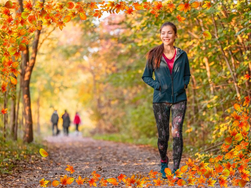 A woman walking during autumn season