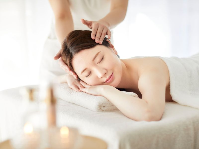 A woman having a relaxing scalp massage