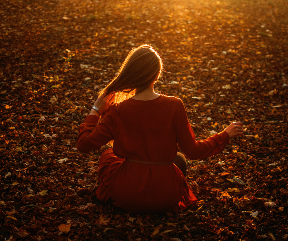 woman touching hair in autumn season