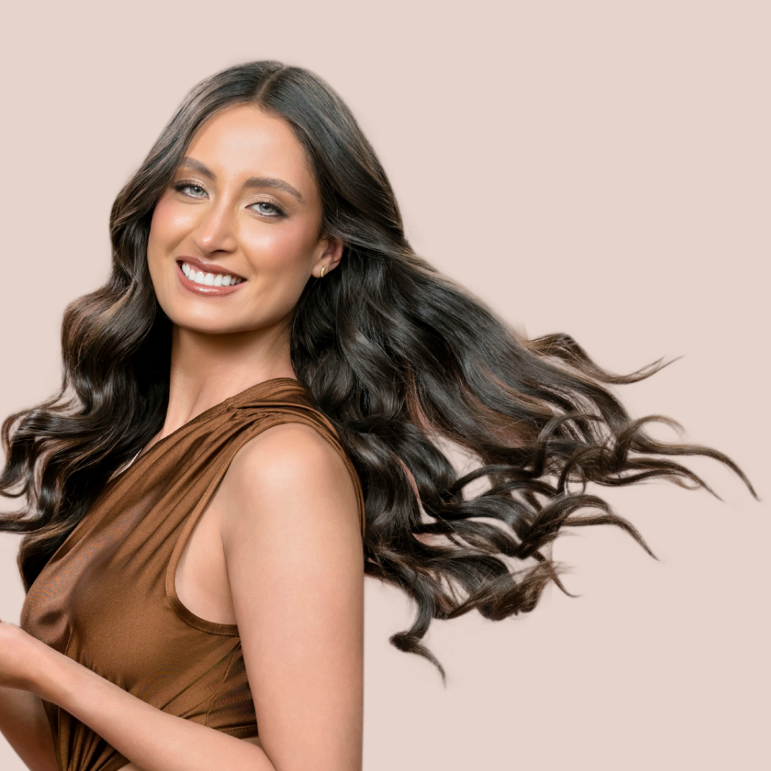 A happy woman promoting REV-320 hair products