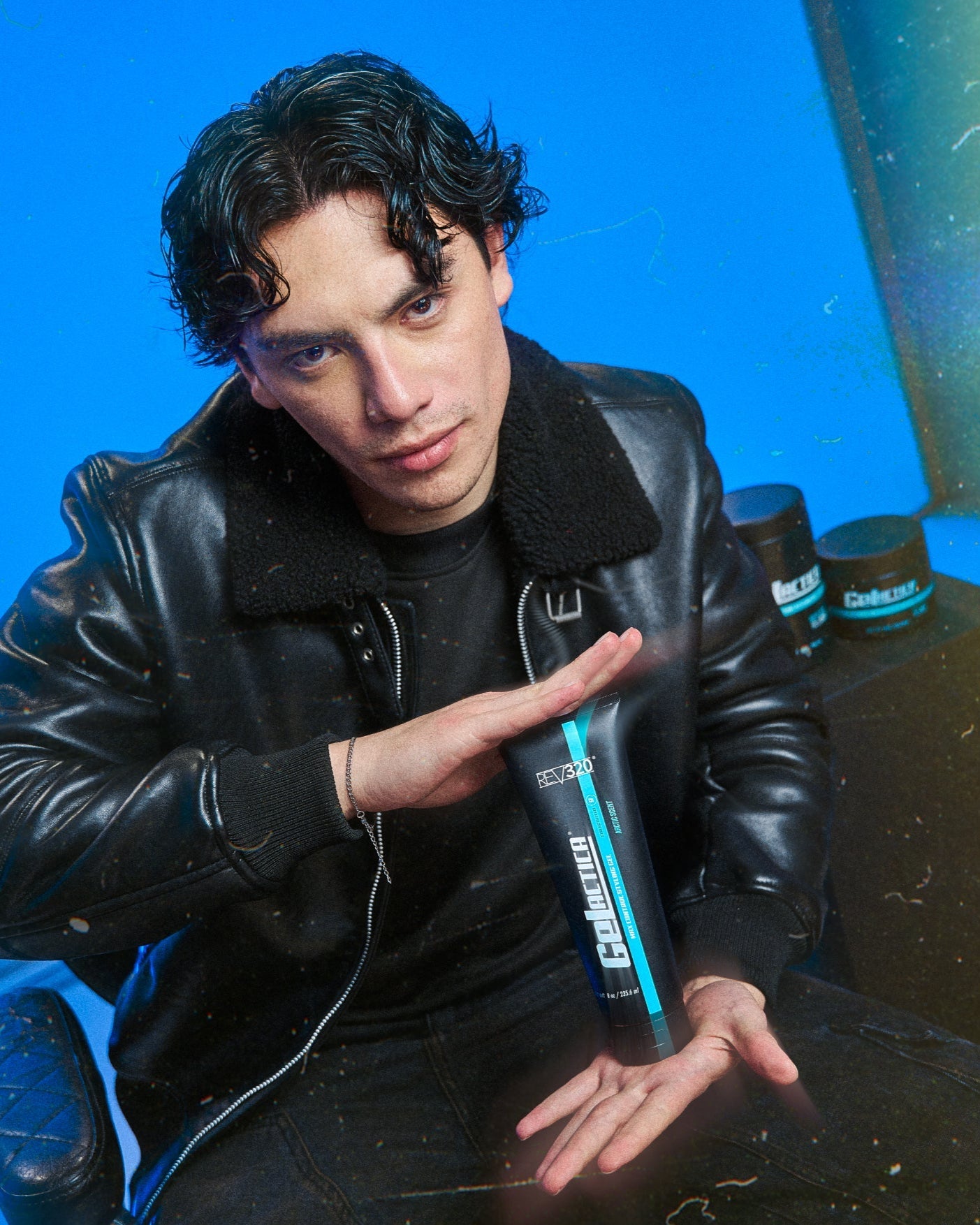 REV-320 model holding Gelactica max control styling hair gel