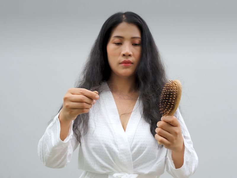 Woman with hair loss dryness and frizziness