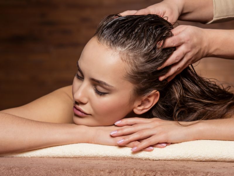 A woman having massage on her scalp
