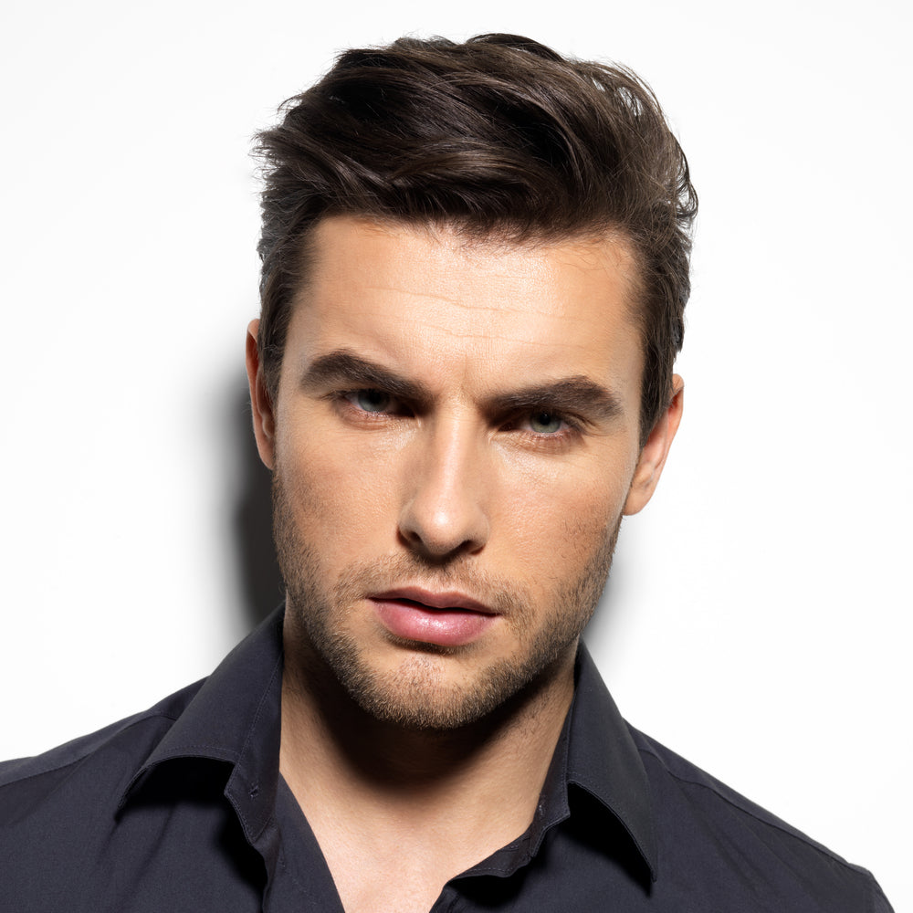 man modeling his face
