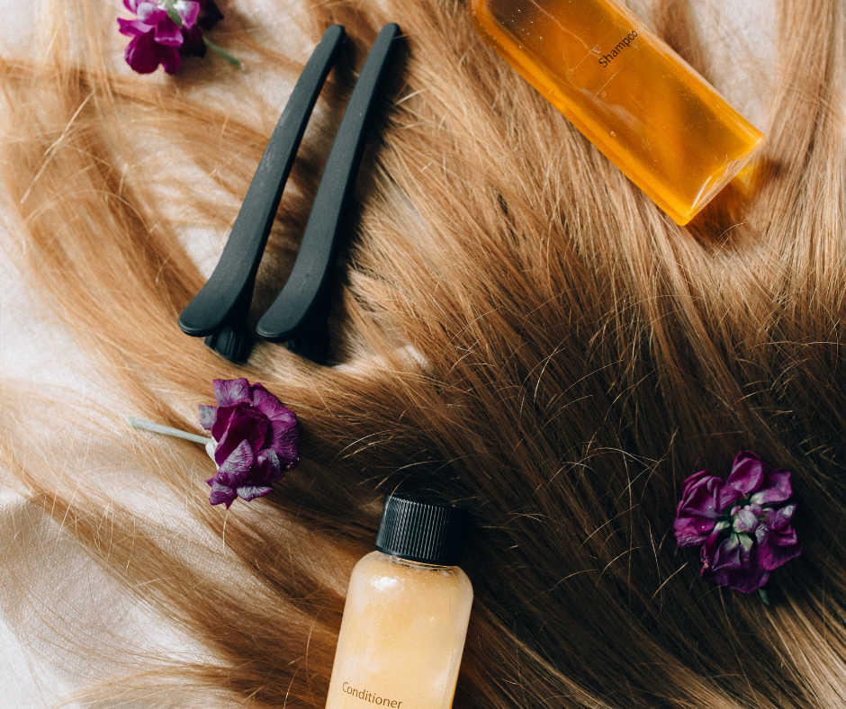 Close-up of a bottle of hair serum and a jar of styling cream