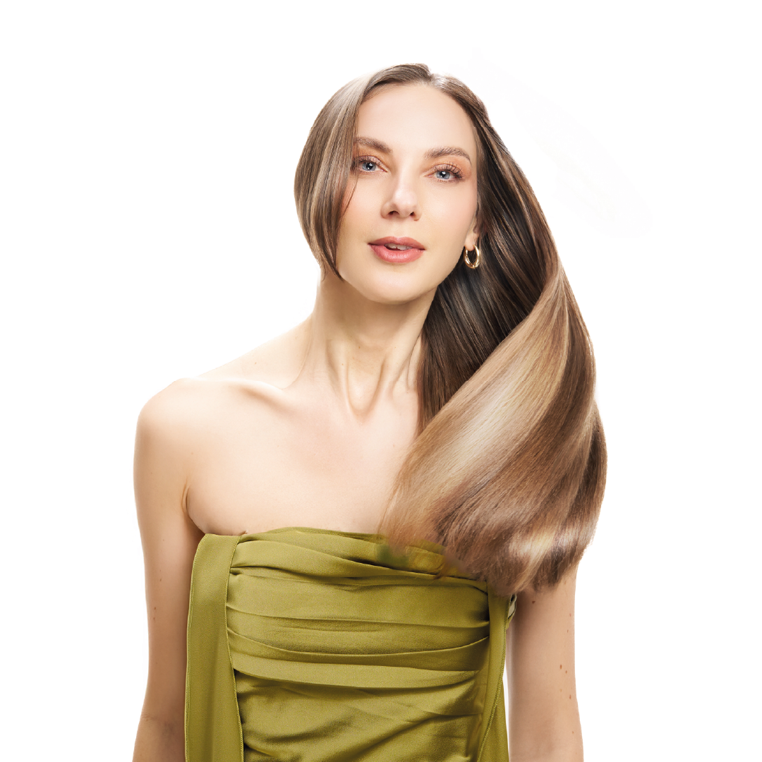 Woman with long, styled hair wearing a green dress on a white background