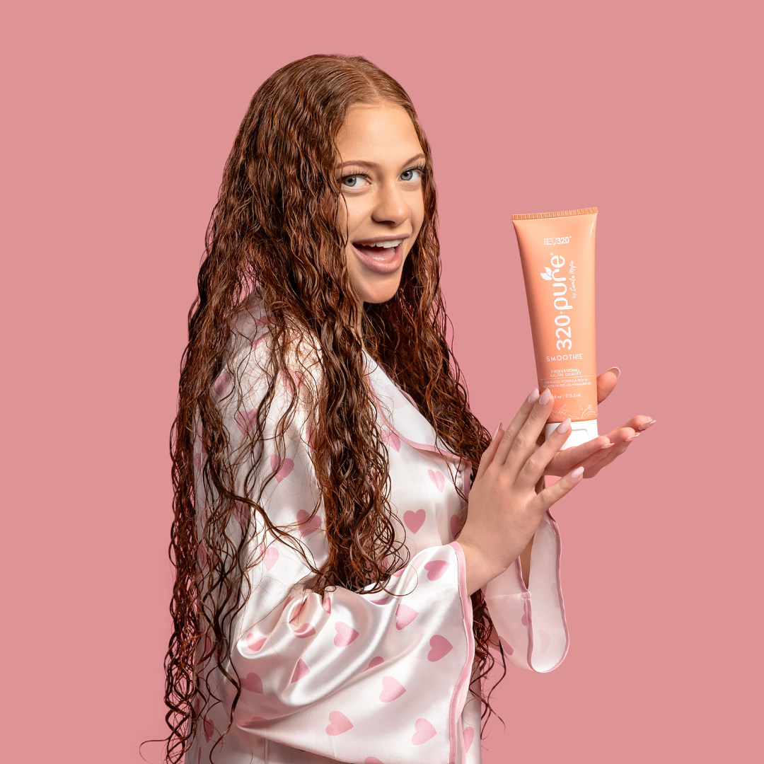 model holding hair smoothie
