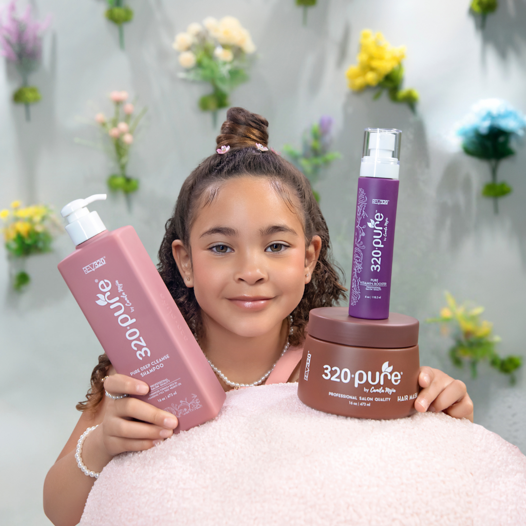 little girl holding 320pure spring hair care bundle trio