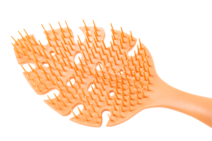 closed up orange detangler brush